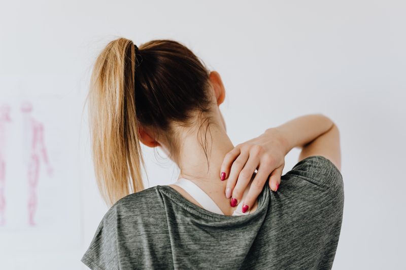 Patient with neck and shoulder discomfort in clinic