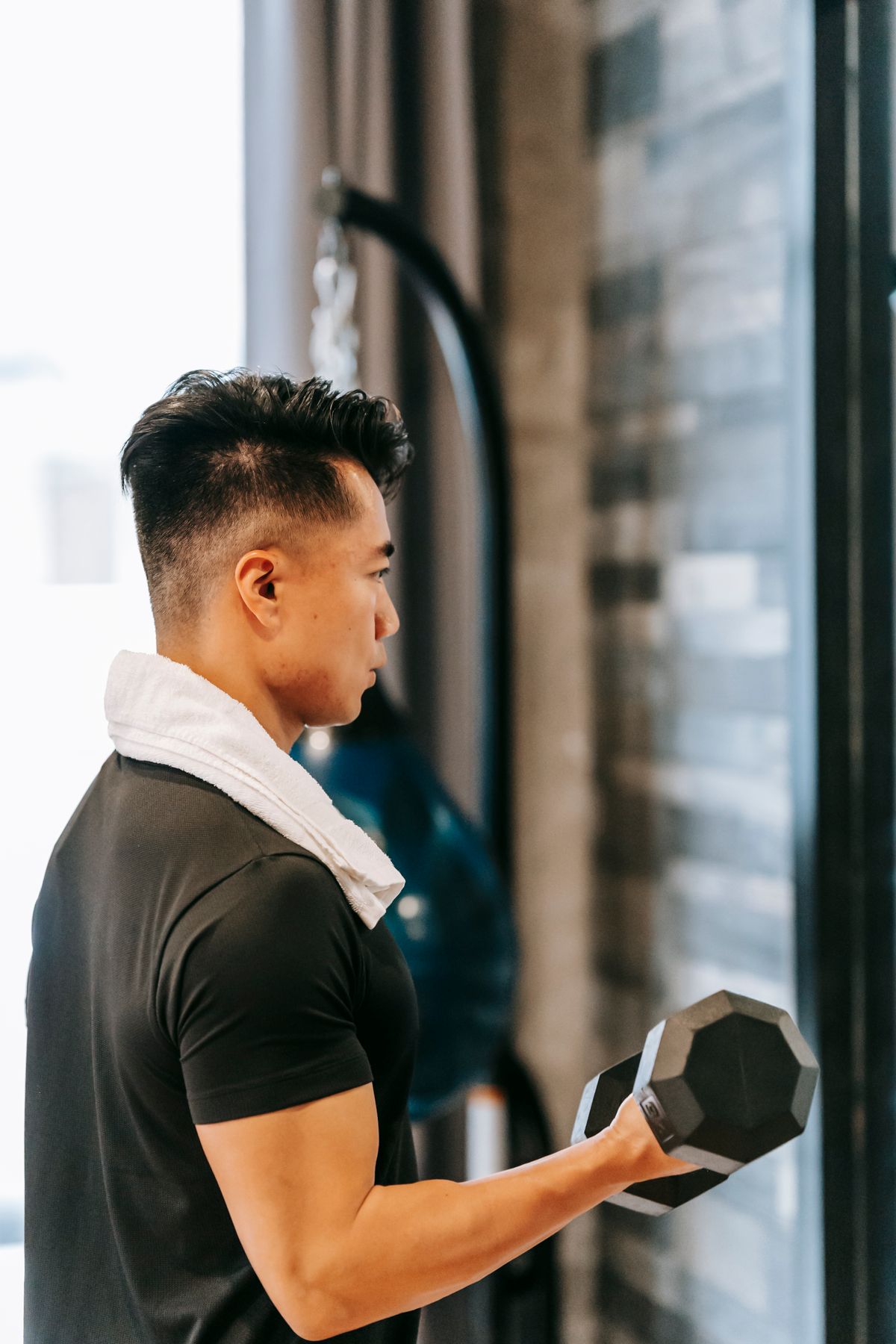 Athlete training with weights during strength rehab
